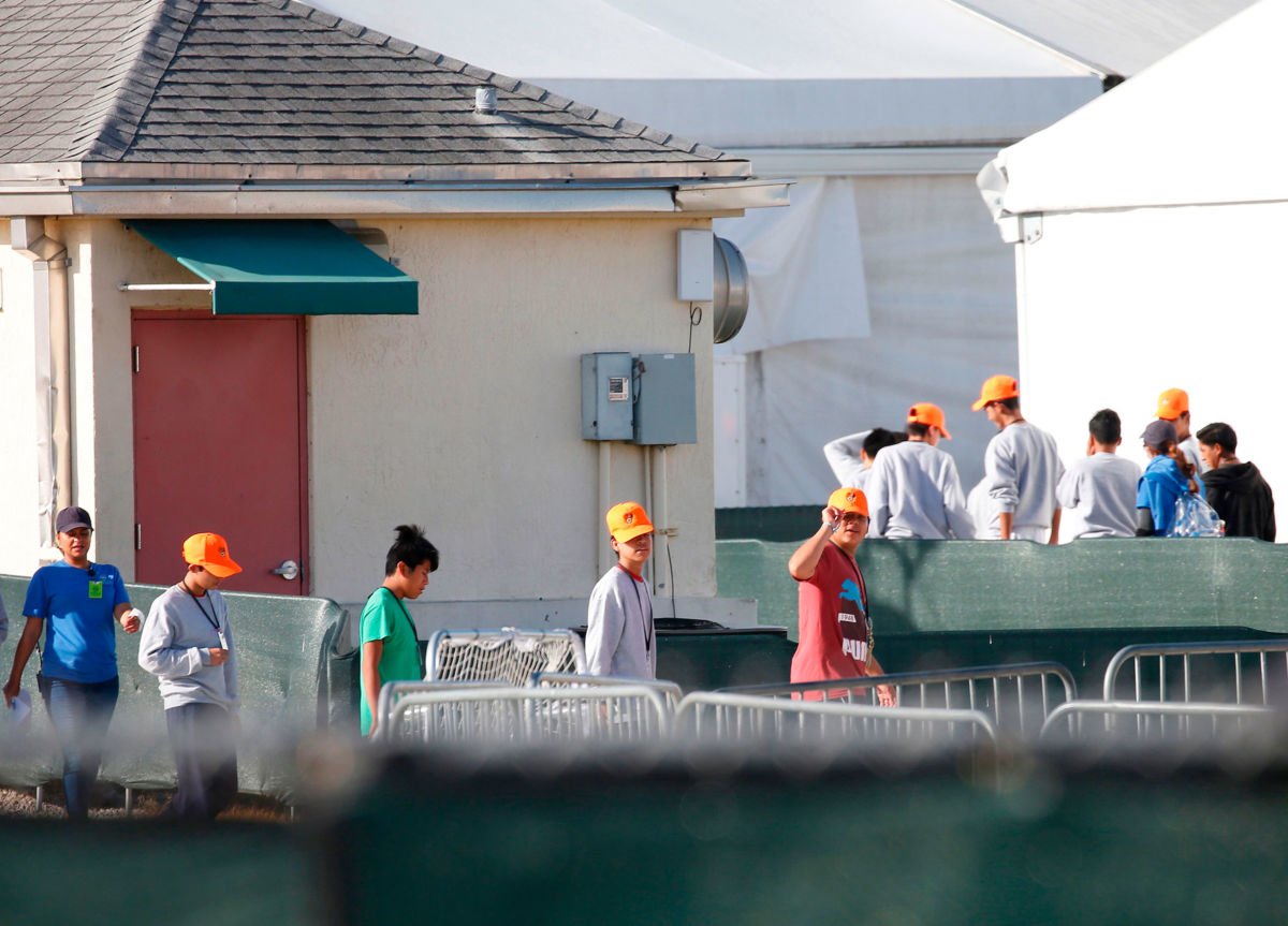 Children who have been separated from their families can be seen in tents at a migrant prison camp in Homestead, Florida, on June 28, 2019.