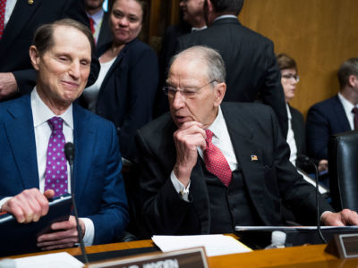 Sens. Ron Wyden (left) and Charles Grassley seen before a Senate Finance Committee hearing on February 26, 2019.