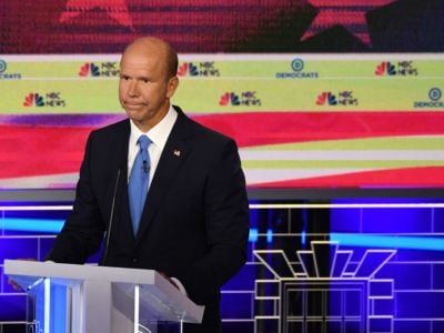 John Delaney stands at a podium