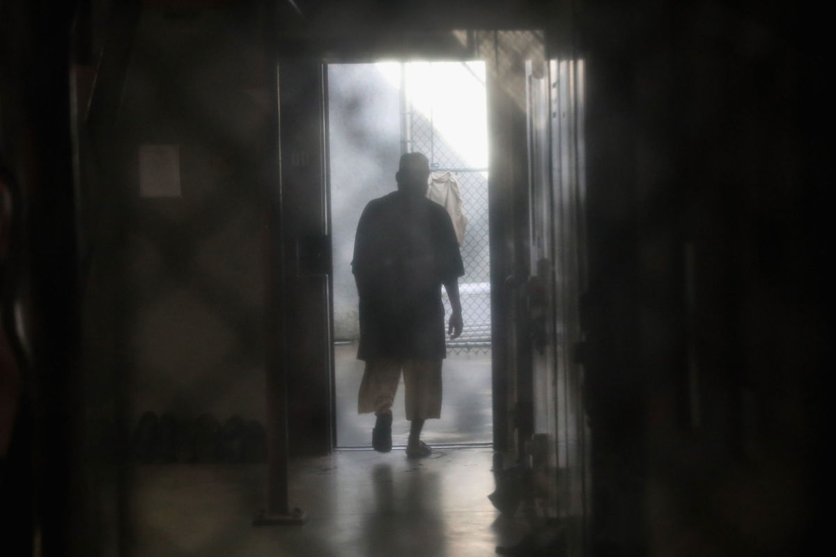 A prisoner walks to an outdoor area of the "Gitmo" maximum security prison on October 22, 2016, at the U.S. Naval Station at Guantanamo Bay, Cuba.