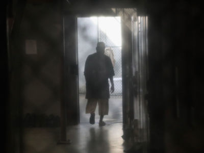 A prisoner walks to an outdoor area of the "Gitmo" maximum security prison on October 22, 2016, at the U.S. Naval Station at Guantanamo Bay, Cuba.