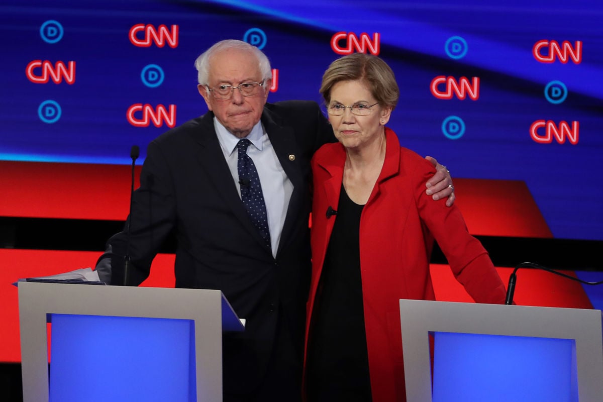 Bernie Sanders and Elizabeth Warren embrace