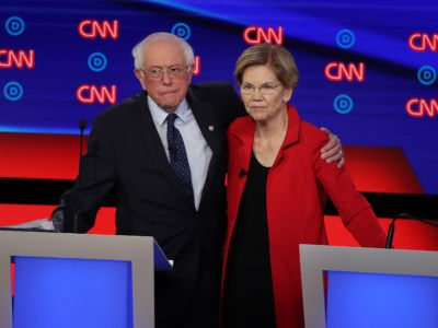 Bernie Sanders and Elizabeth Warren embrace