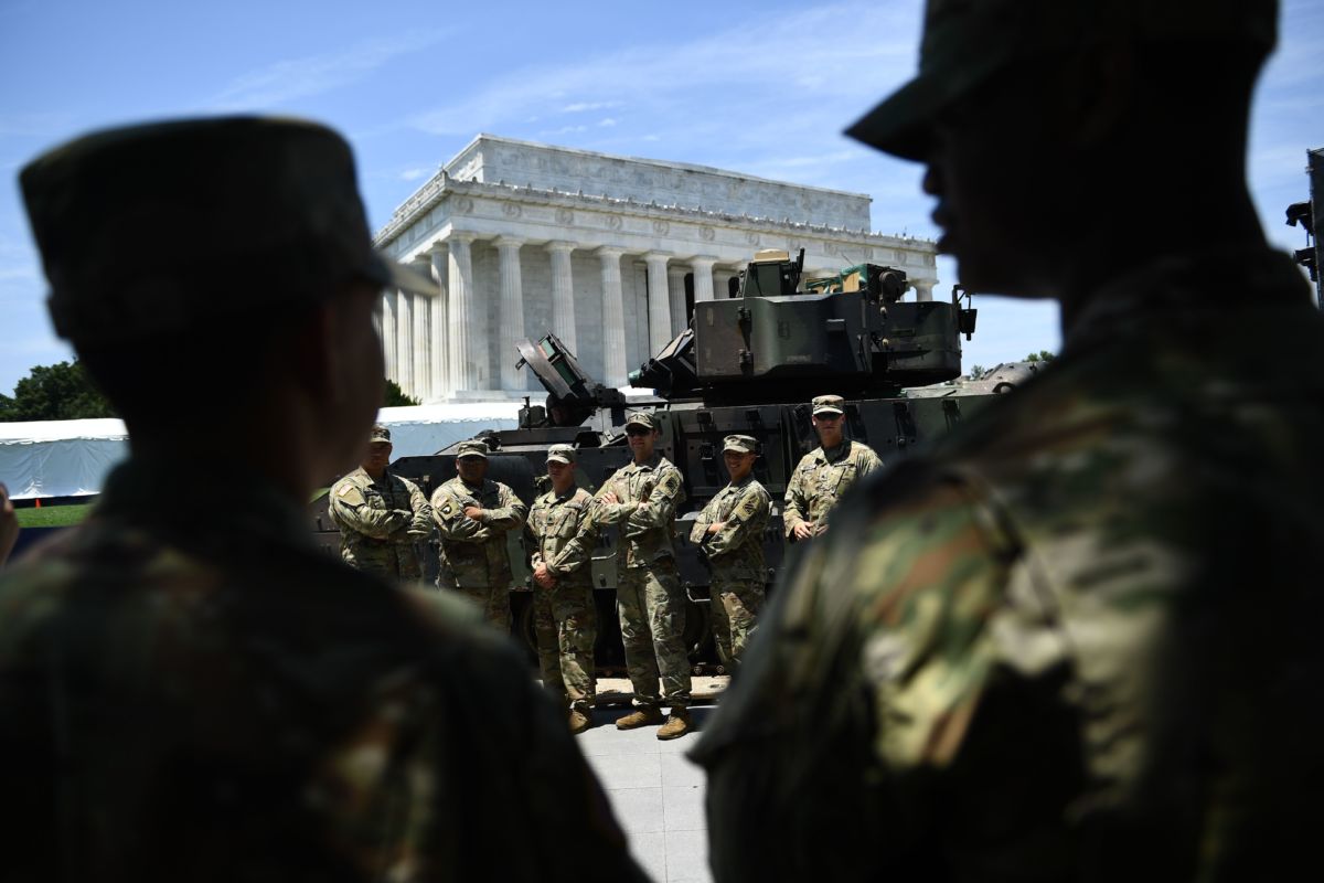 Members of the US military stand by as preparations are made for the "Salute to America" Fourth of July event with Donald Trump at the Lincoln Memorial on the National Mall in Washington, D.C., on July 3, 2019.