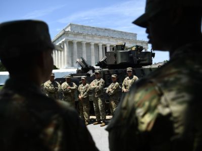 Members of the US military stand by as preparations are made for the "Salute to America" Fourth of July event with Donald Trump at the Lincoln Memorial on the National Mall in Washington, D.C., on July 3, 2019.