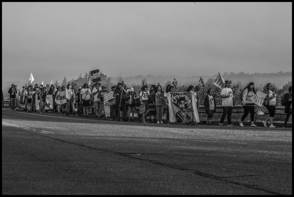 The marchers as they string out along the highway in the early morning.