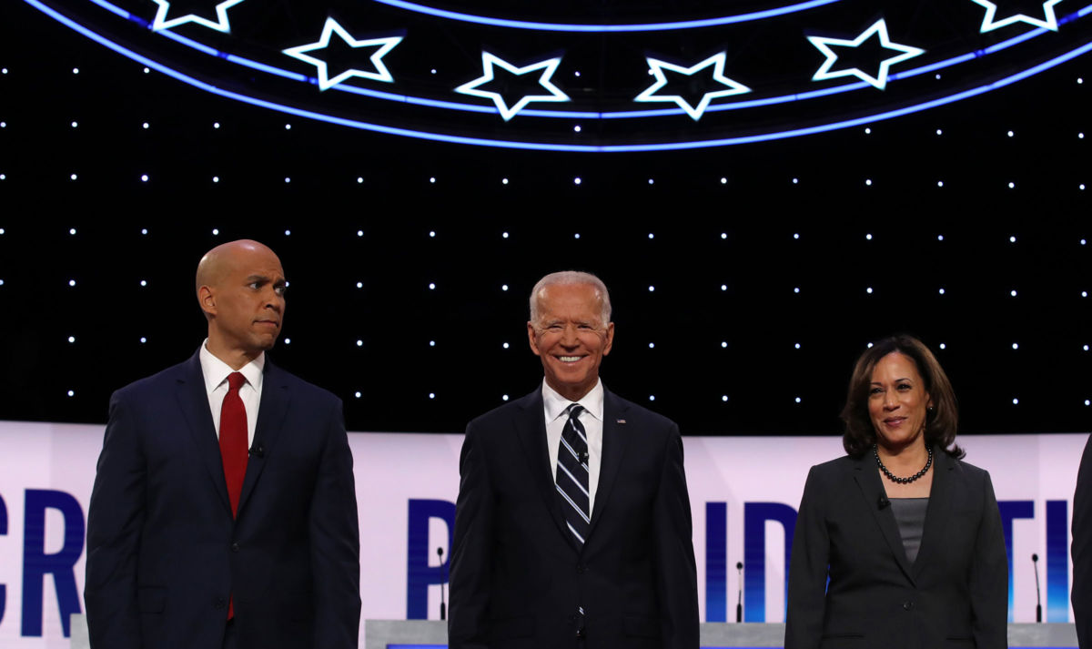 Sen. Cory Booker, former Vice President Joe Biden and Sen. Kamala Harris take the stage at the Democratic Presidential Debate at the Fox Theatre, July 31, 2019, in Detroit, Michigan.