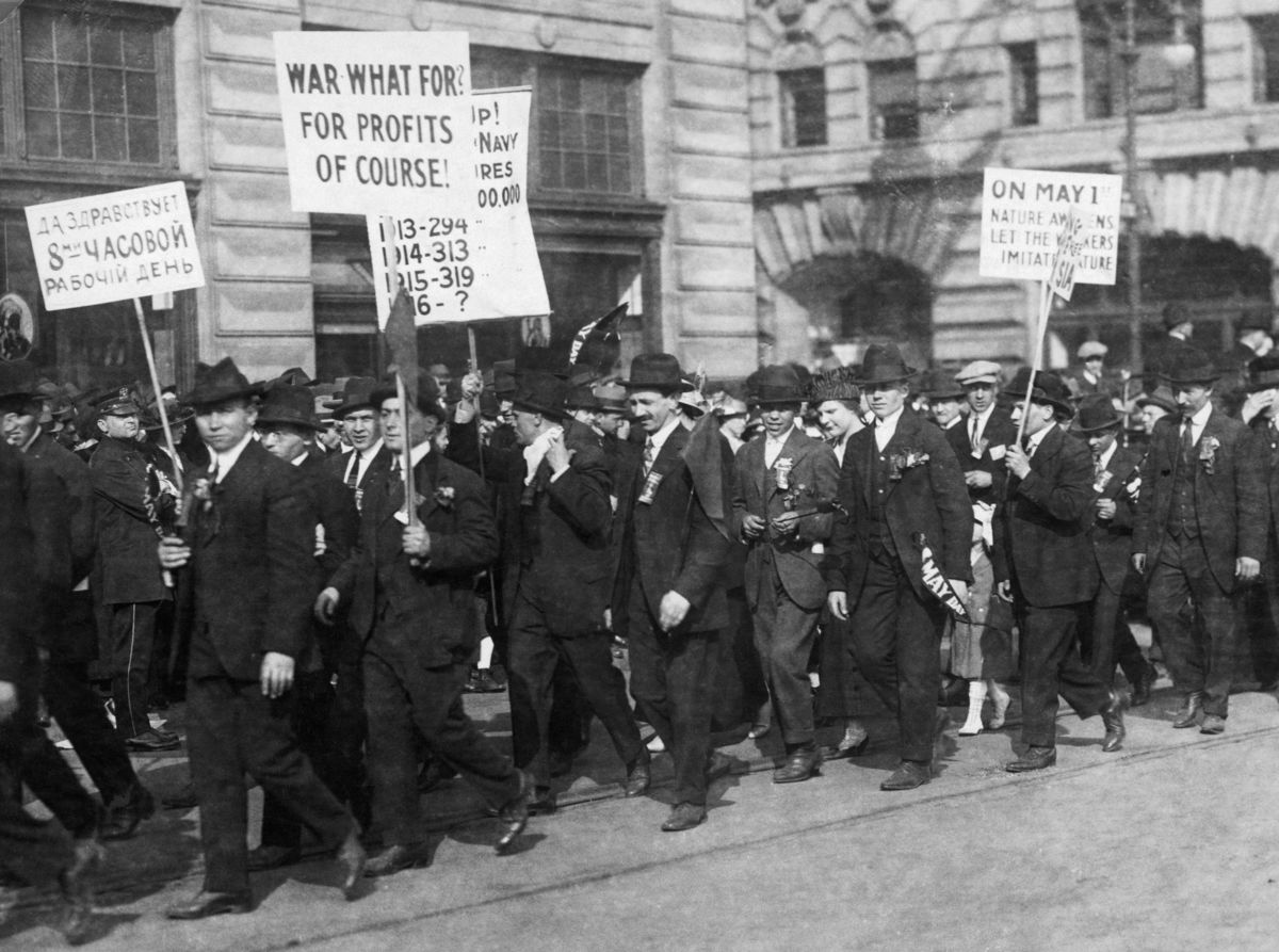 Antiwar demonstrators carrying placards in the May Day parade on January 1, 1916. People who opposed WWI were prosecuted by the hundreds and faced assault by vigilante groups.