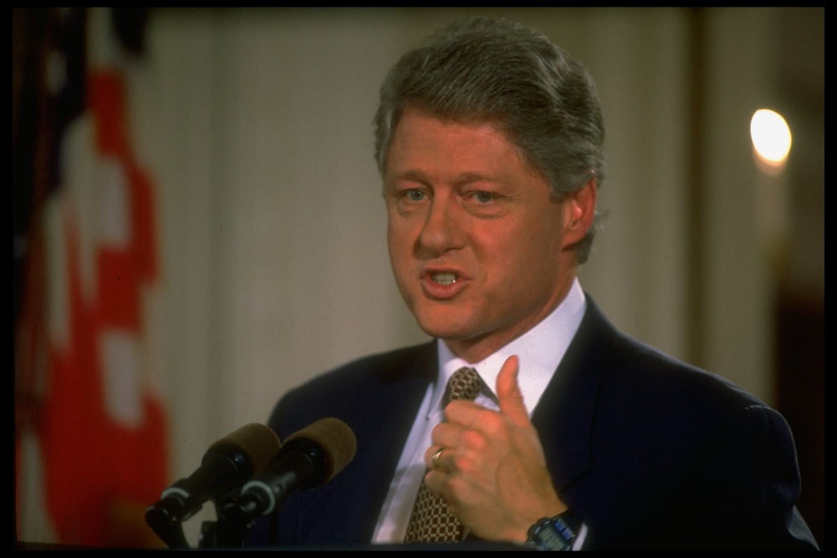 Bill Clinton speaks into a microphone