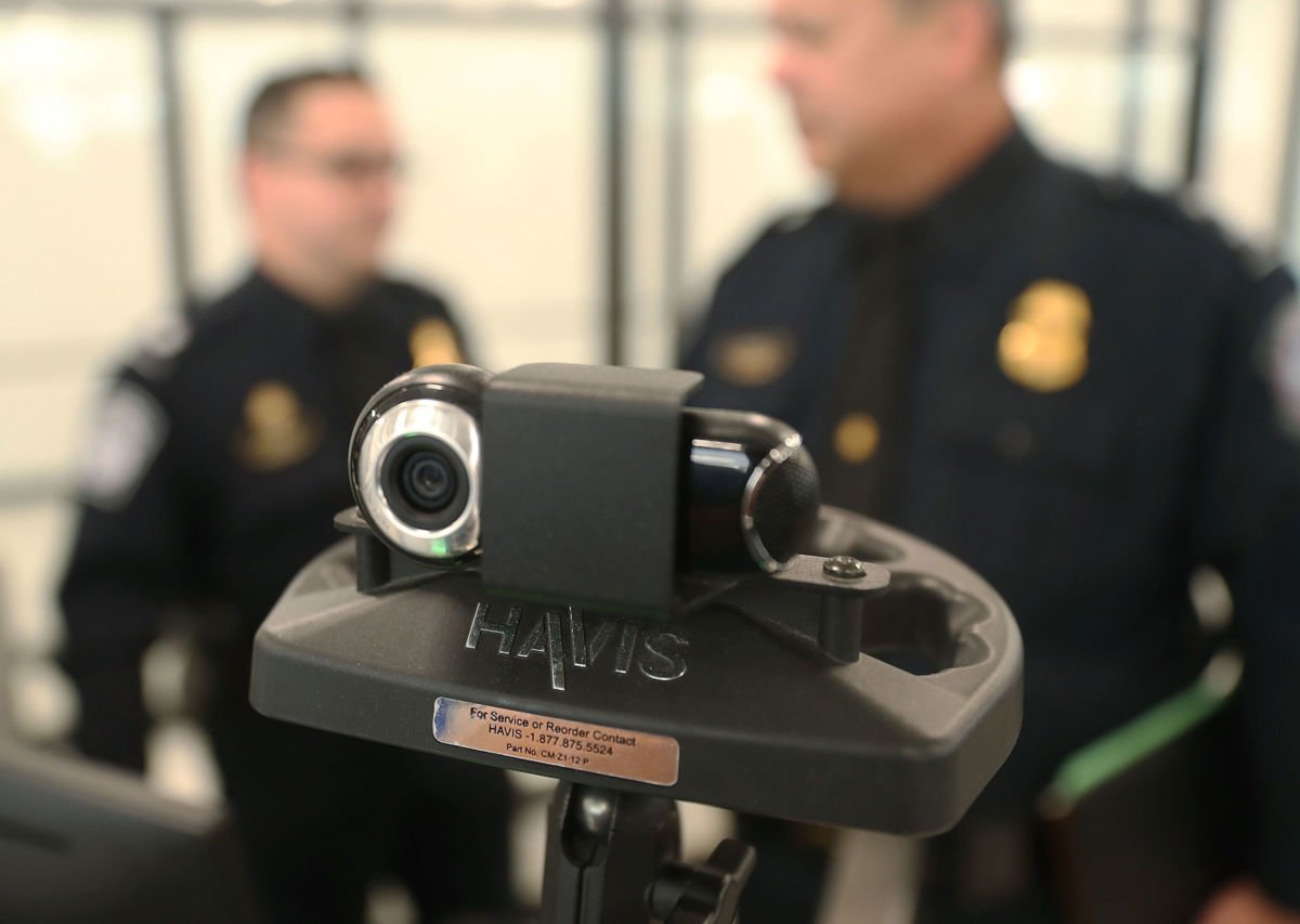 U.S. Customs and Border Protection officers use a facial recognition device at Miami International Airport to screen travelers entering the United States on February 27, 2018, in Miami, Florida.