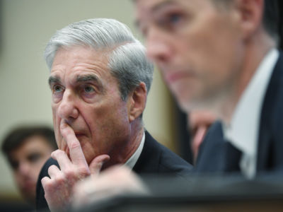 Robert Mueller listens during a hearing