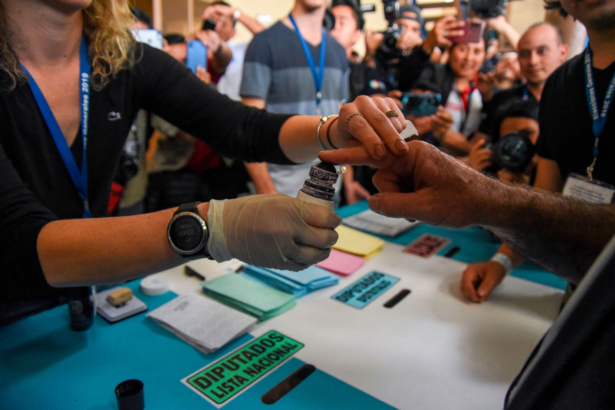 Guatemalan candidate for the Vamos party, Alejandro Giammattei, votes at a polling station in Guatemala City on June 16, 2019, during general elections.