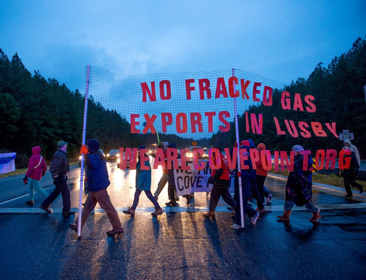 Protesters rally against fracking during rush hour commute along highway 2/4 in Lusby, Maryland, on December 2, 2014. Even after passage of a ban, Maryland has continued to support fracking through the buildup of fracking infrastructure.