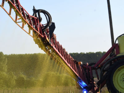 A farmer sprays Roundup 720 herbicide produced by agrochemical giant Monsanto on May 11, 2018, on a field of corn in Piace, northwestern France.