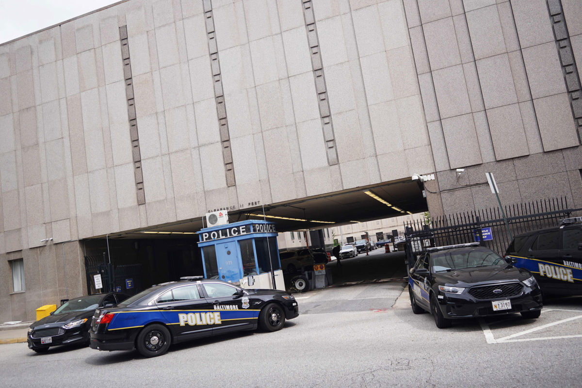 Police cars are seen outside of the Baltimore City Police Headquarters in Baltimore, Maryland, on August 8, 2017.