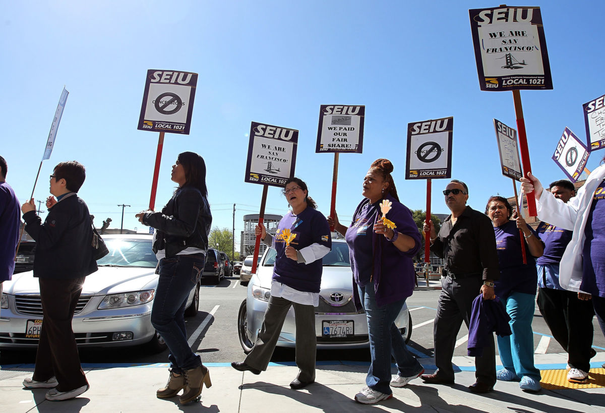 Members of the SEIU Local 1021 protest outside of San Francisco General Hospital on March 21, 2012, in San Francisco, California.