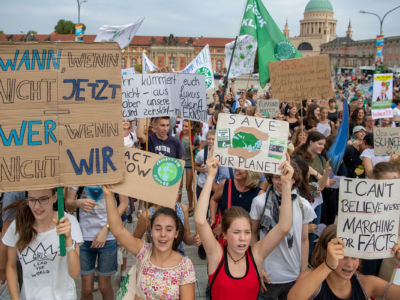 Supporter of the Fridays for Future movement hold placards during a protest for climate action on August 30, 2019, in Potsdam, eastern Germany.