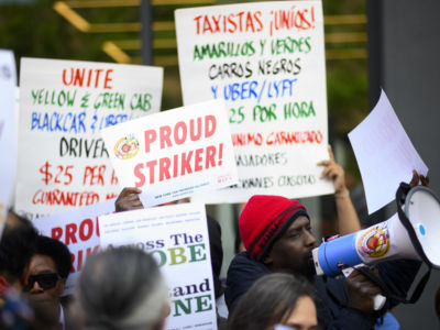 Drivers take part in a rally demanding more job security and livable incomes, at Uber and Lyft New York City Headquarters on May 8, 2019.