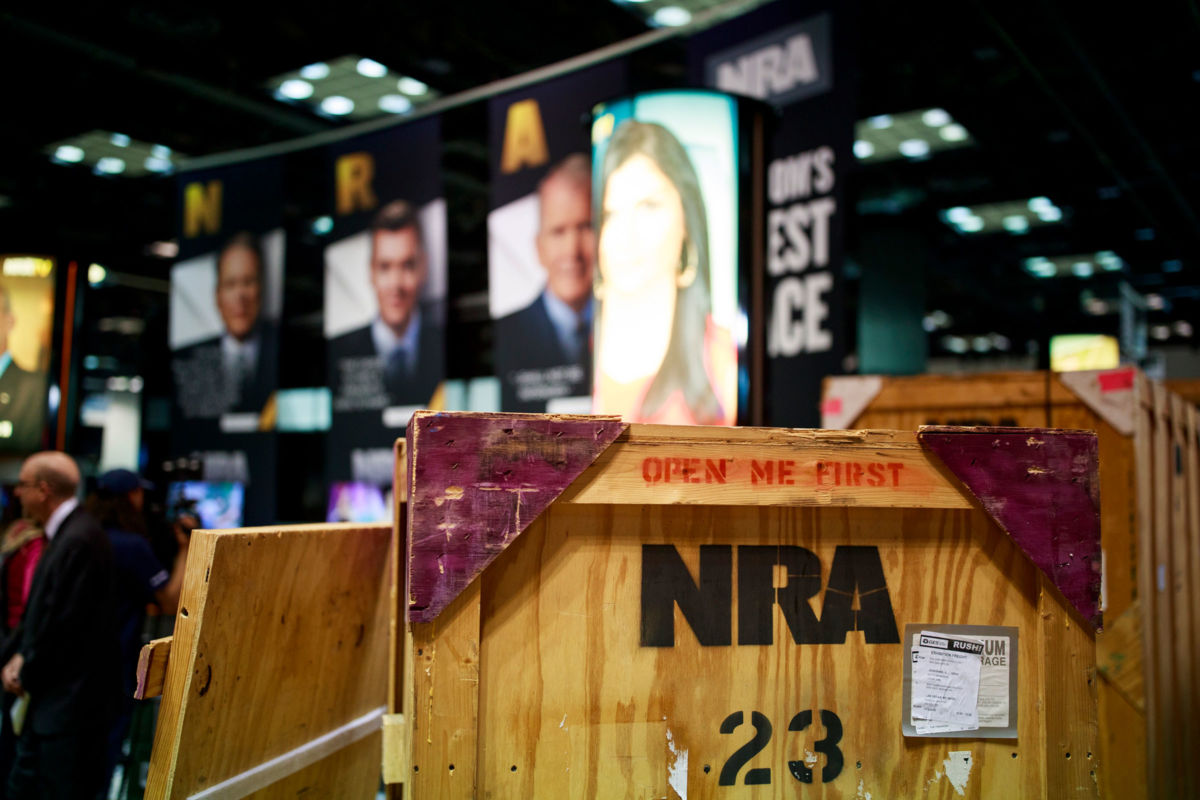 Vendors prepare booths in the exhibition hall before the National Rifle Association (NRA) convention at the Indiana Convention Center in downtown Indianapolis, April 25, 2019.