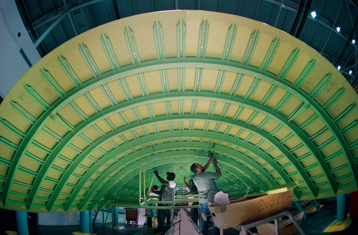 Engineers work on the Boeing 747-400 production line.