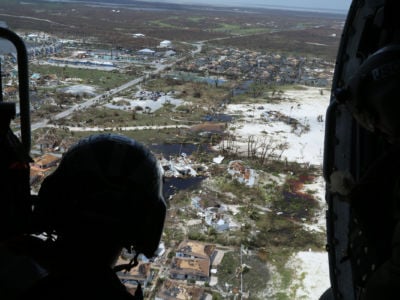 Mike Lewis of the U.S. Coast Guard inspects areas damaged by Hurricane Dorian in support of search-and-rescue efforts and humanitarian aid in the Bahamas on September 4, 2019.