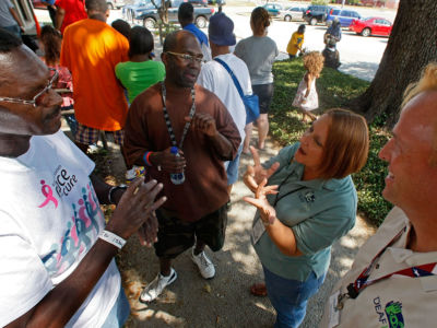 People talk to eachother in sign language