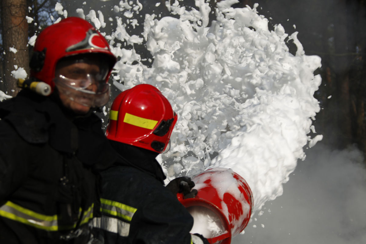 Firefighter extinguishes a fire.