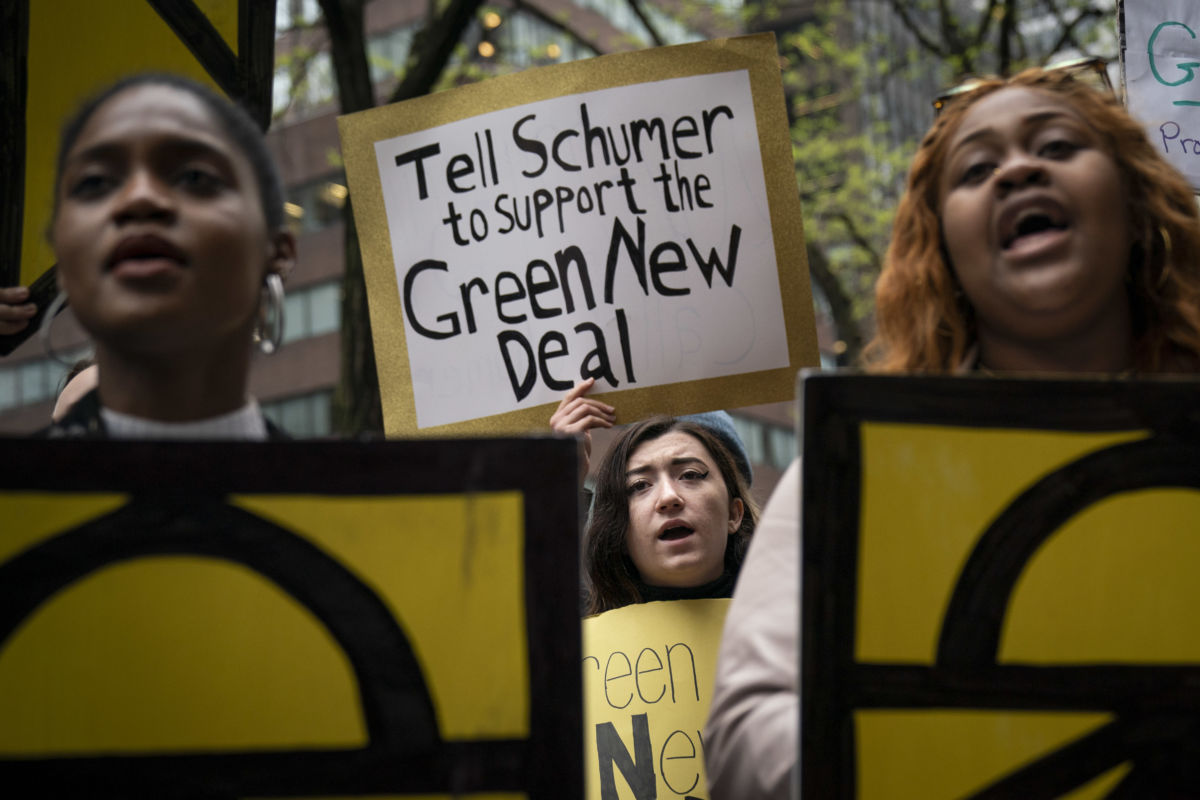 Activists rally in support of proposed "Green New Deal" legislation outside of Senate Minority Leader Chuck Schumer's New York City office, April 30, 2019 in New York City.