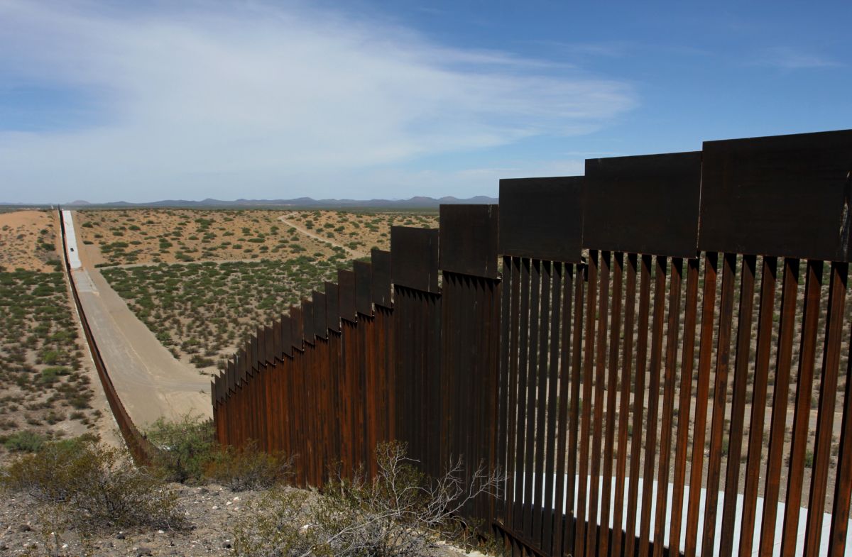 Trump's border fence streches out to the horizon