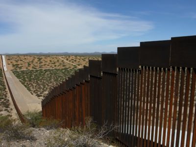 Trump's border fence streches out to the horizon