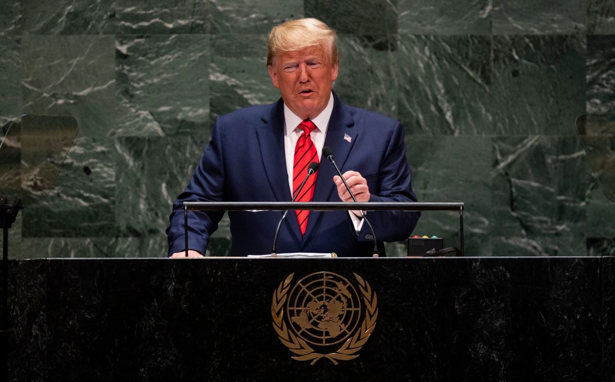 Donald Trump speaks in front of the green marble of the united nations headquarters
