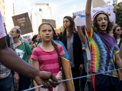 Greta Thurnberg marches with other activists during the climate strike