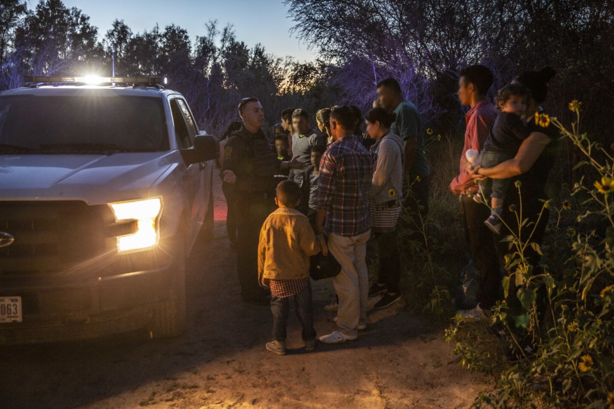U.S. Border Patrol agents assigned to the McAllen border patrol station encounter a group of migrants near Los Ebanos, Texas, on June 15, 2019.