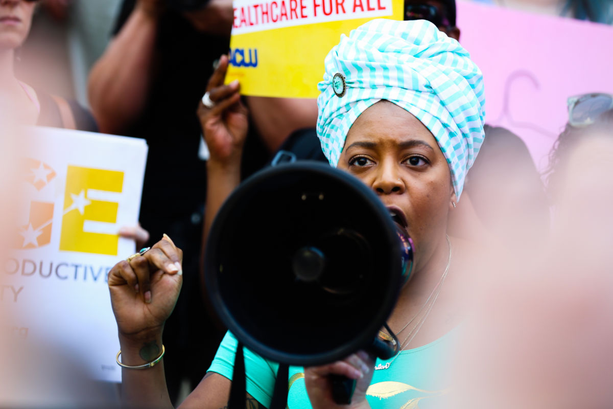 A woman speaks during a protest against recently passed abortion ban bills at the Georgia State Capitol building, on May 21, 2019 in Atlanta, Georgia.