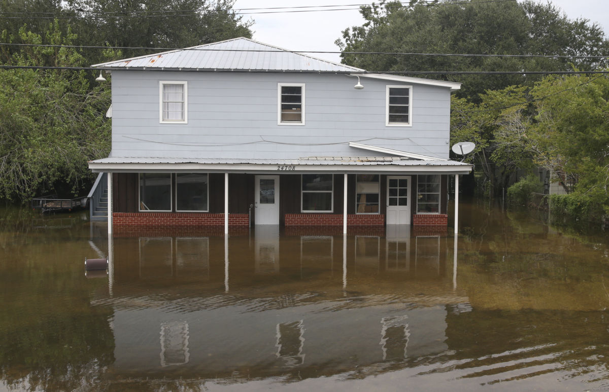 A house sits in flooded waters on September 20, 2019, in Beaumont, Texas.