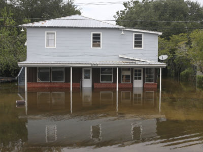 A house sits in flooded waters on September 20, 2019, in Beaumont, Texas.