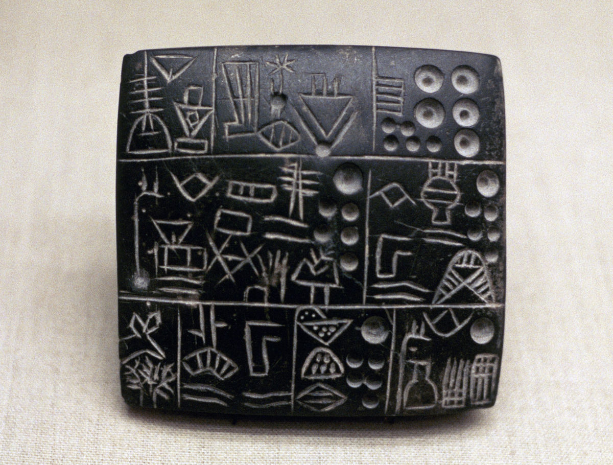 Administrative tablet of clay, Mesopotamian/Sumerian, 3100-2900 BC. The earliest tablets with written inscriptions represent the work of administrators, perhaps of large temple institutions, recording the allocation of rations or the movement and storage of goods.