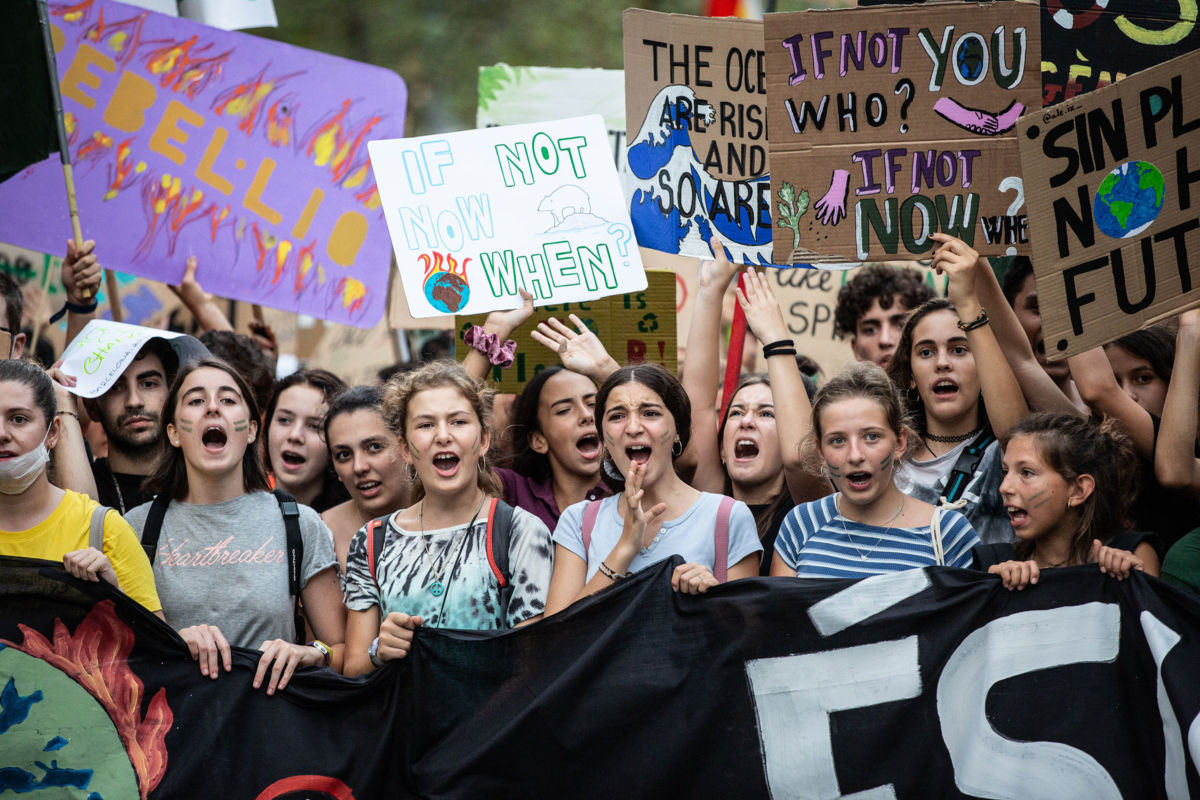 Demonstrators hold banners at a protest in support of the global climate strike on September 27, 2019, in Barcelona, Spain.