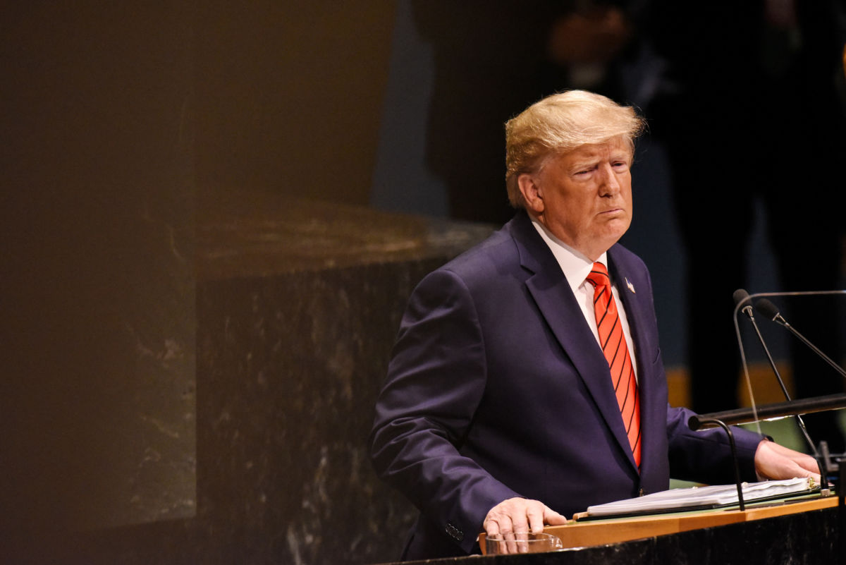 Donald Trump stands at a podium in the United Nations