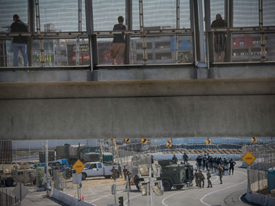 United States military personnel and Border Patrol agents secure the United States-Mexico border on November 25, 2018, at the San Ysidro border crossing point south of San Diego, California.