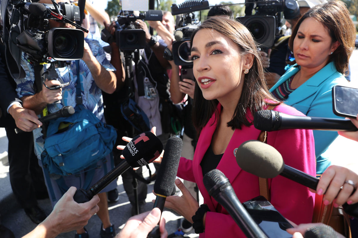 Rep. Alexandria Ocasio-Cortez talks to reporters before heading into the U.S. Capitol Building, September 27, 2019, in Washington, D.C.