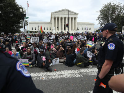 Protesters rally in front of the U.S. Supreme Court as arguments are heard in a set of cases concerning the rights of transgender and LGBQ people in the workforce on October 8, 2019, in Washington, D.C.