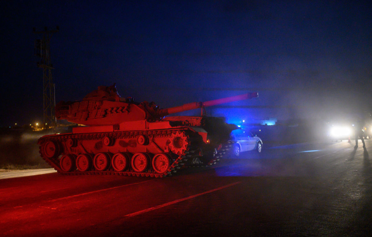 Turkish armed forces drive towards the border with Syria near Akcakale in Sanliurfa province on October 8, 2019.