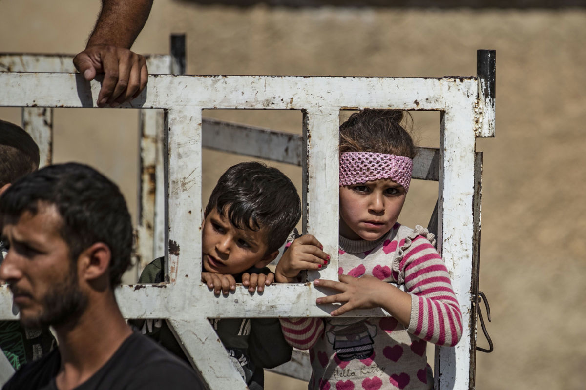 Syrian Arab and Kurdish civilians arrive to Hassakeh city after fleeing following Turkish bombardment on Syria's northeastern towns along the Turkish border on October 10, 2019.