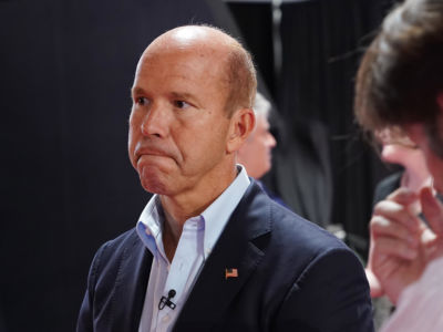 John Delaney frowns while backstage