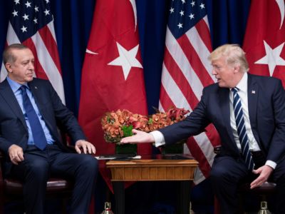 Donald Trump extends a hand to shake Recep Tayyip Erdogan's hand