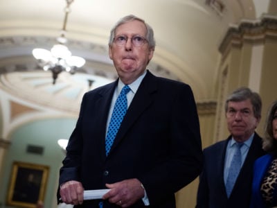 Mitch Mcconnell makes a face while preparing to make a statement