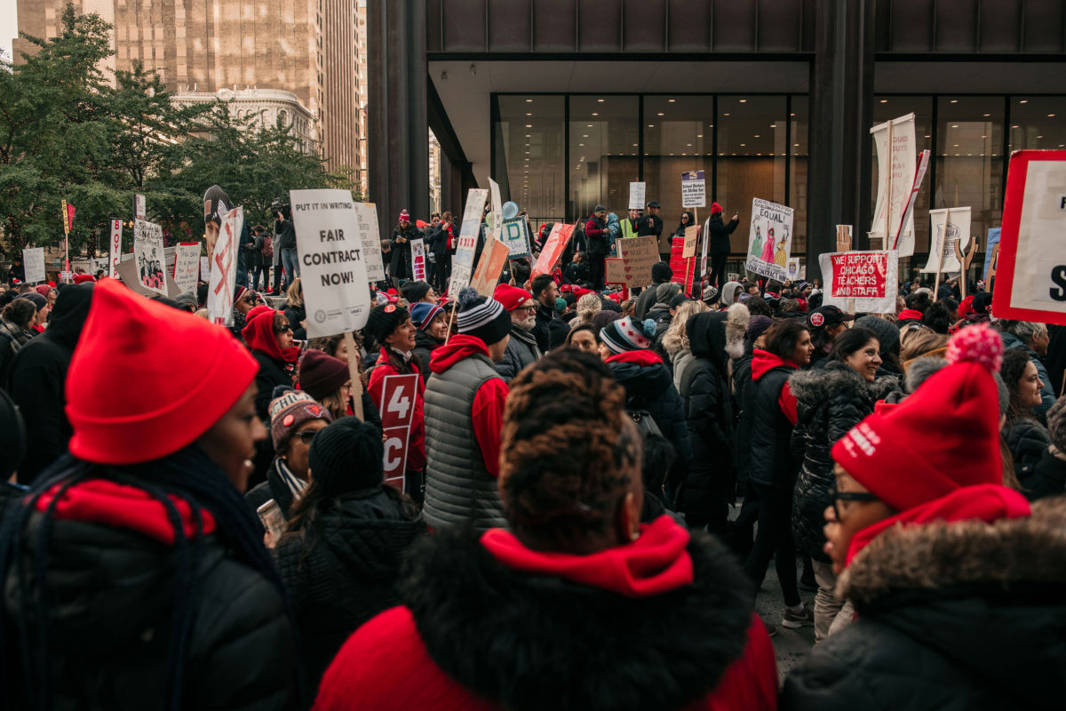 Thousands of demonstrators take to the streets, stopping traffic and circling City Hall in a show support for the ongoing teachers' strike on October 23, 2019, in Chicago, Illinois.