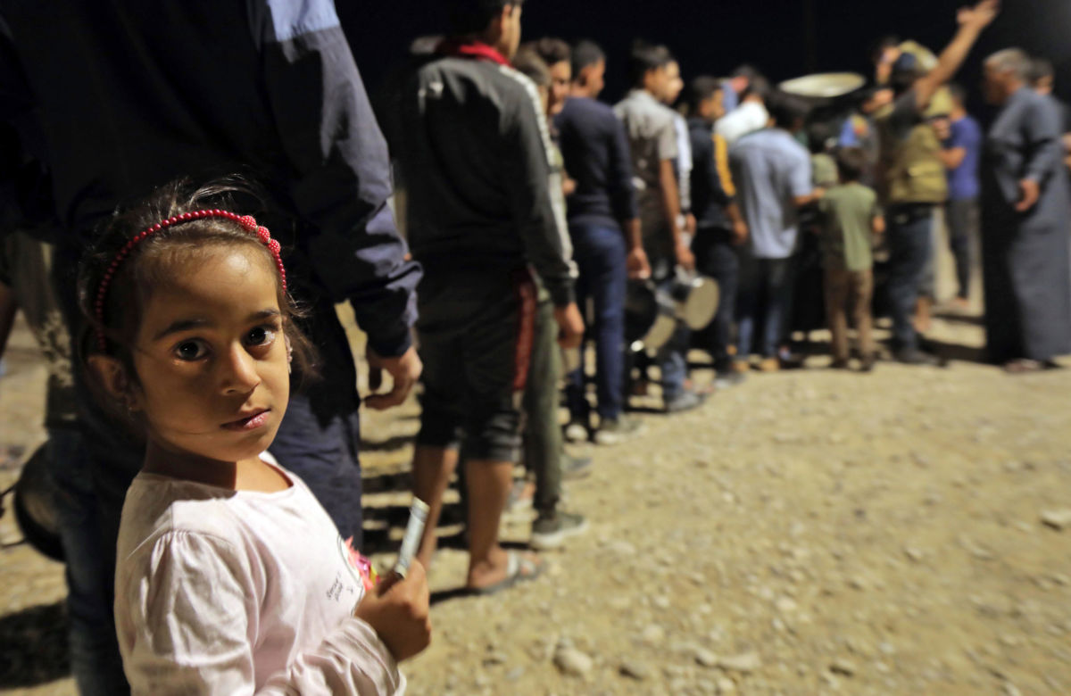 Syrian refugees arrive at the Bardarash camp in Iraq's autonomous Kurdish region, on October 20, 2019.