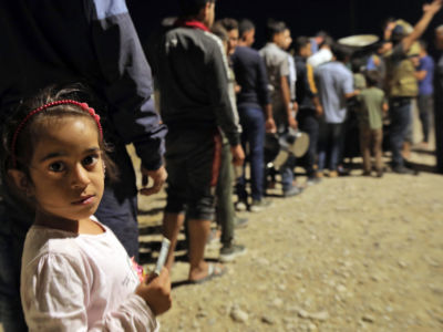 Syrian refugees arrive at the Bardarash camp in Iraq's autonomous Kurdish region, on October 20, 2019.